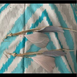 Feather earrings.